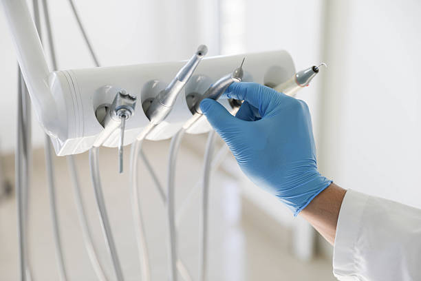 Professional Tooth Extraction technician working in Santa Fe County County, NM